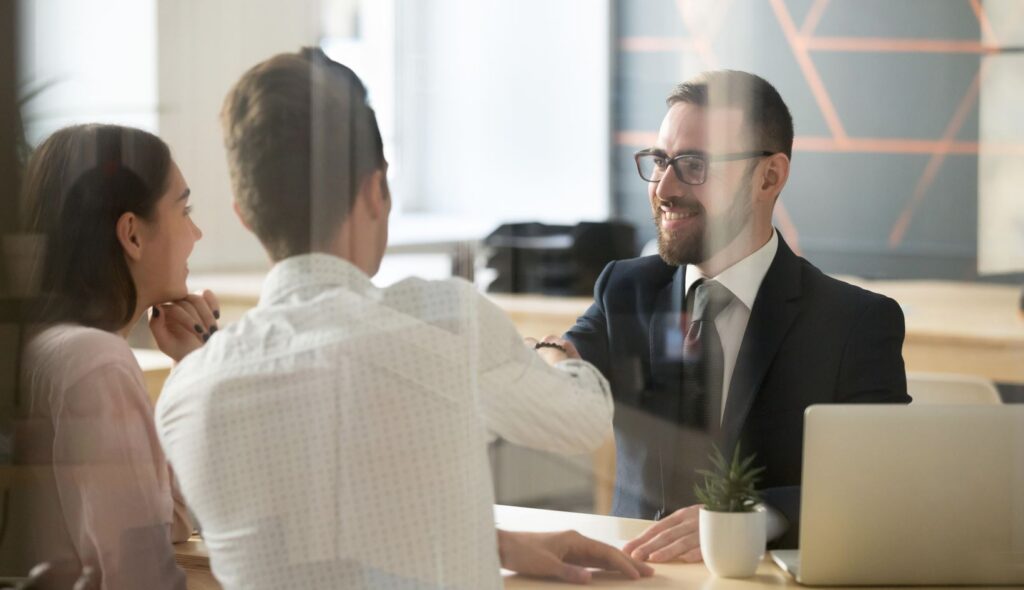 Start A Tax Preparation Business — meeting with clients at a consulting table